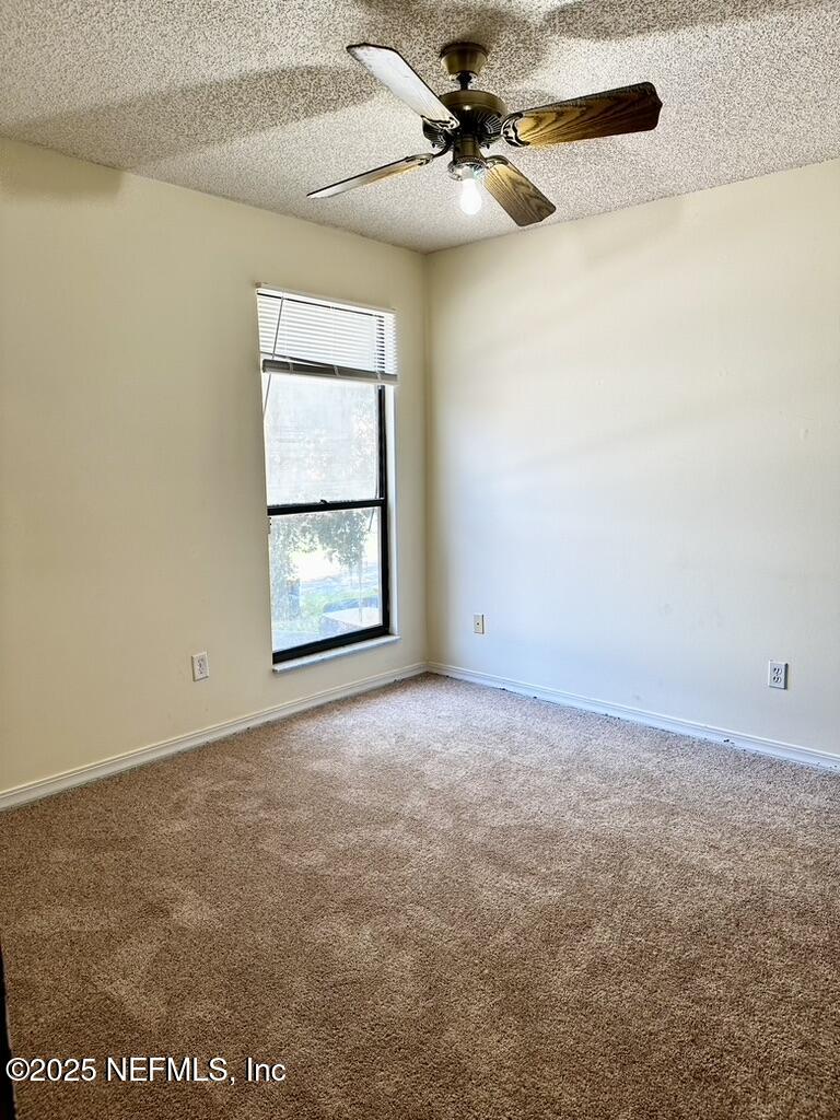 11368 Canvasback Court Jacksonville, FL 32225 - Photo 15 of 19 an empty room with windows and fan