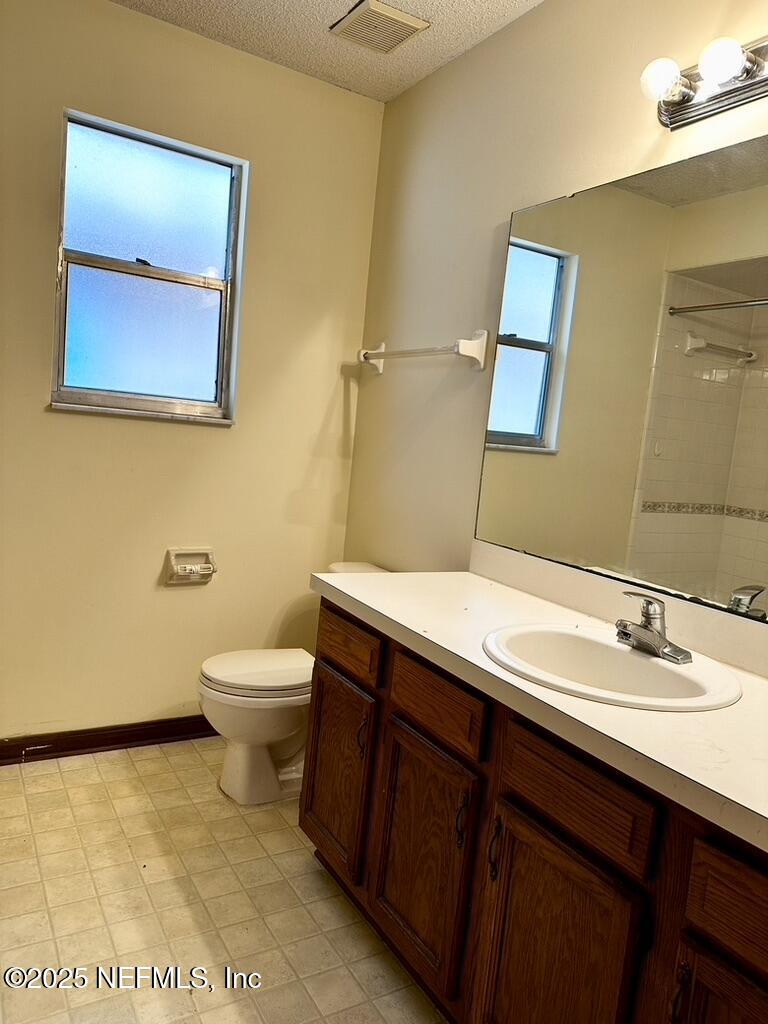 11368 Canvasback Court Jacksonville, FL 32225 - Photo 17 of 19 a bathroom with a sink a toilet and mirror