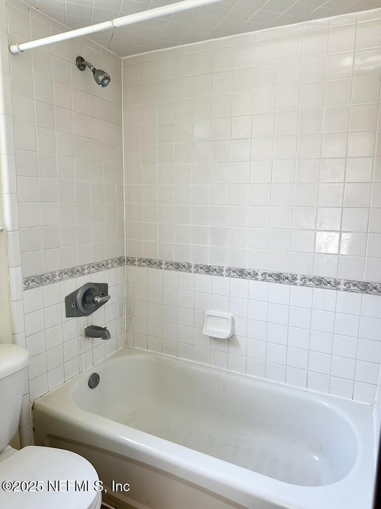 11368 Canvasback Court Jacksonville, FL 32225 - Photo 18 of 19 a bathroom with a bathtub and shower