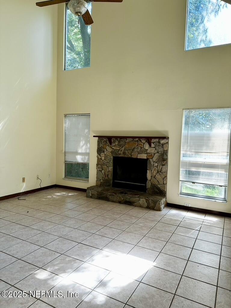 11368 Canvasback Court Jacksonville, FL 32225 - Photo 4 of 19 a view of an empty room with a fireplace and a window