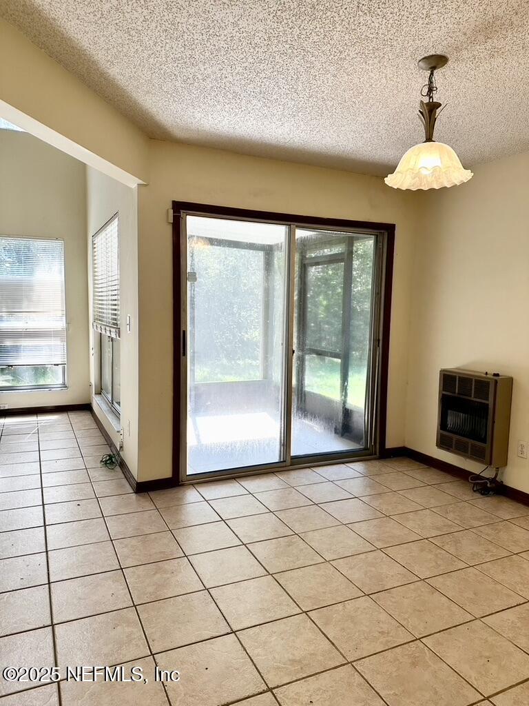 11368 Canvasback Court Jacksonville, FL 32225 - Photo 6 of 19 a view of a room with a large window and chandelier