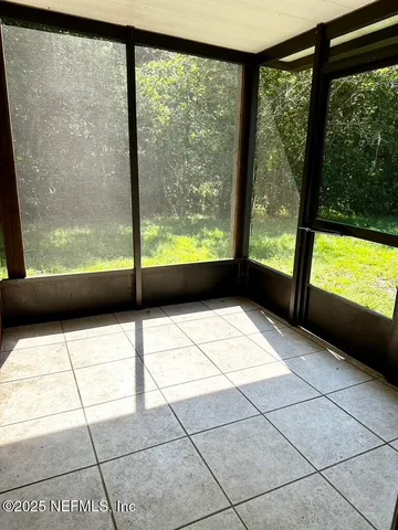 a large kitchen with stainless steel appliances granite countertop a sink and cabinets
