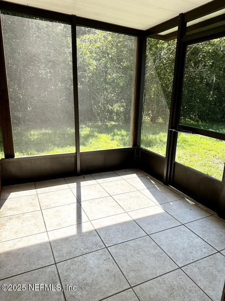 11368 Canvasback Court Jacksonville, FL 32225 - Photo 7 of 19 a view of empty room with large windows