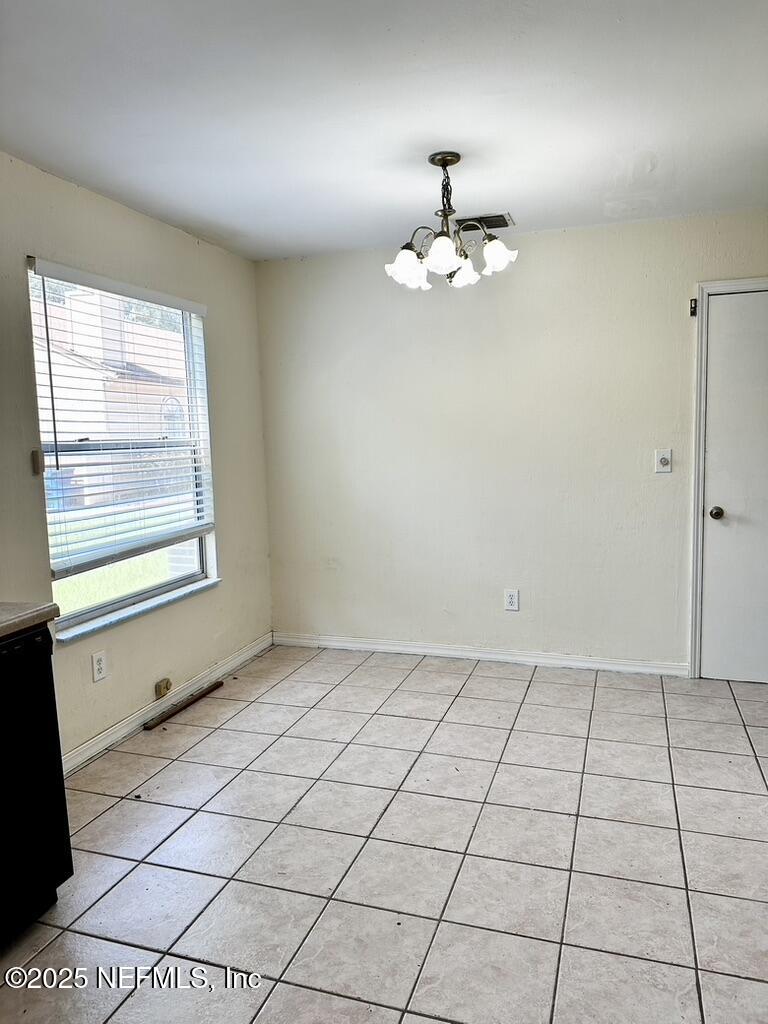 11368 Canvasback Court Jacksonville, FL 32225 - Photo 9 of 19 an empty room with windows and fan