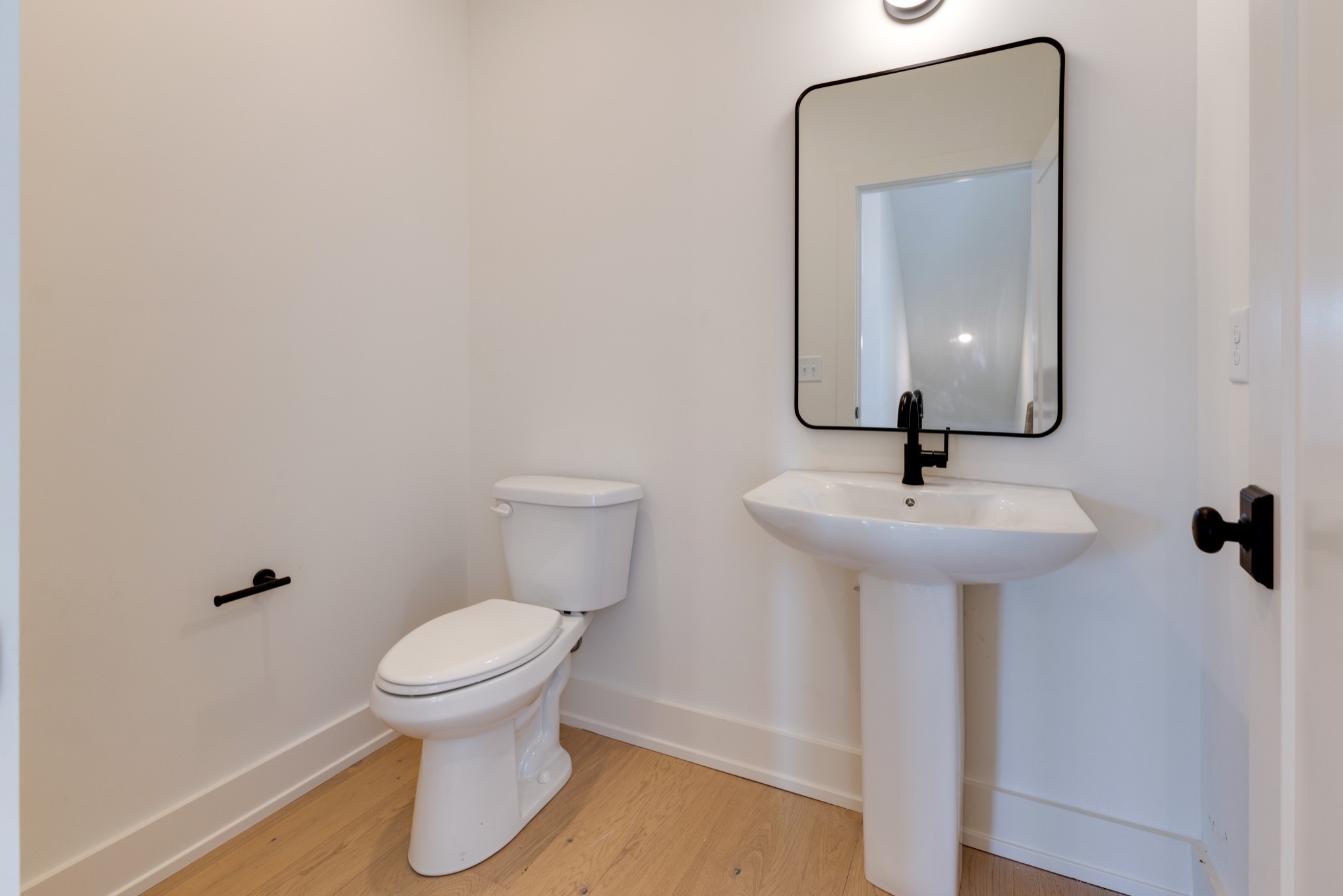 533 Midnight Way Nashville, TN 37209 - Photo 15 of 42 a bathroom with a toilet sink and mirror