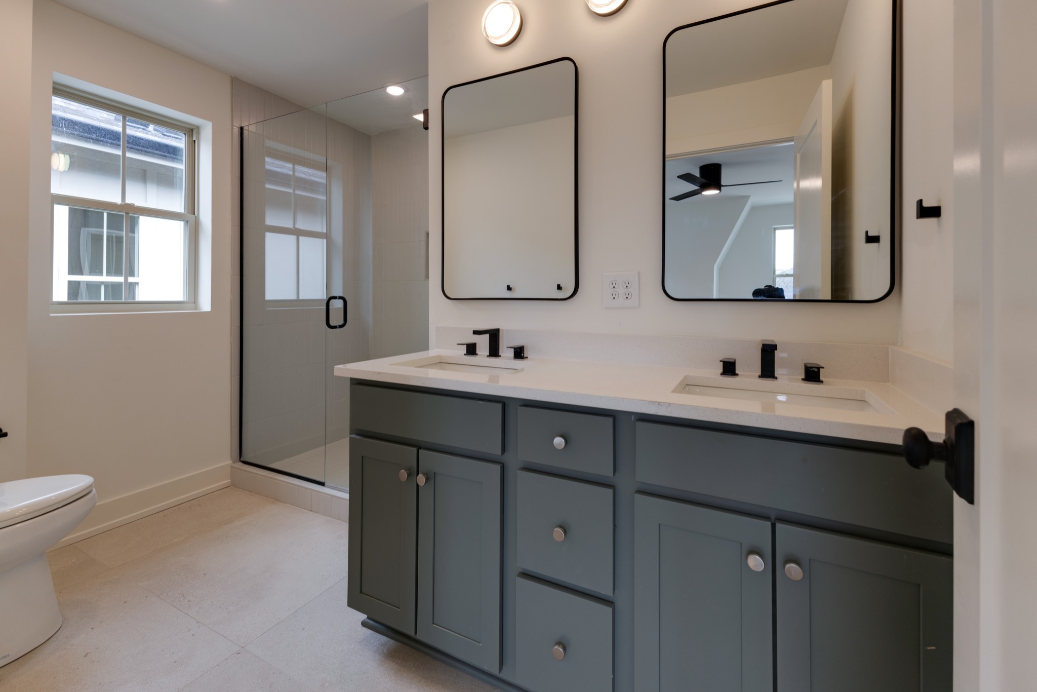 533 Midnight Way Nashville, TN 37209 - Photo 19 of 42 a bathroom with a double vanity sink mirror and toilet