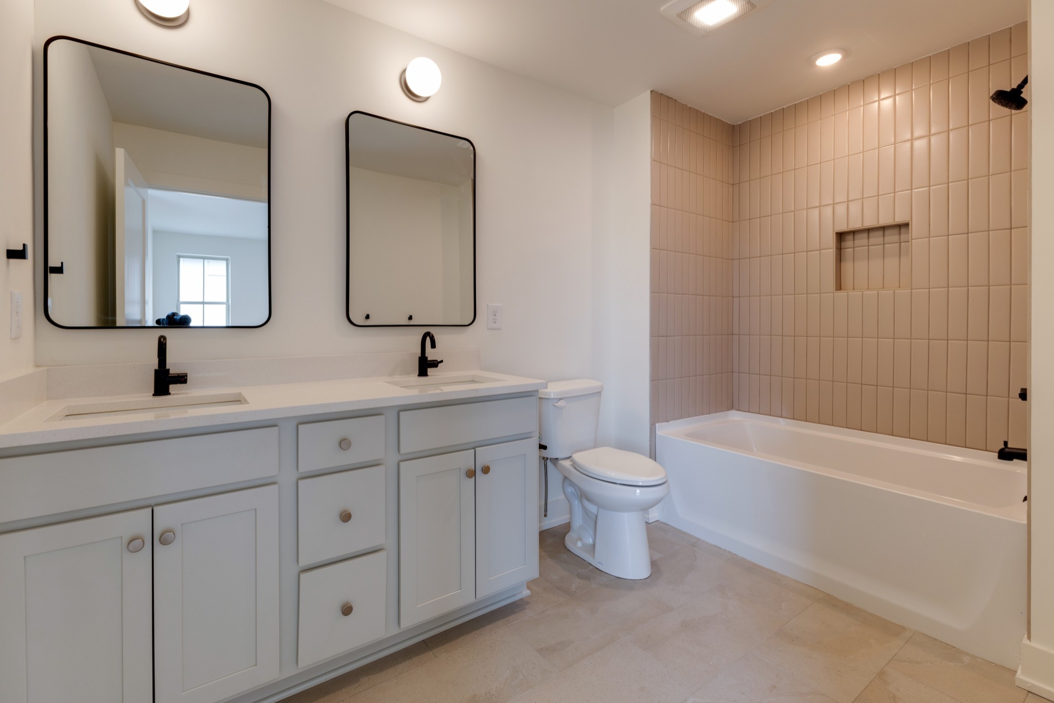 533 Midnight Way Nashville, TN 37209 - Photo 24 of 42 a bathroom with a toilet a sink a tub and mirror