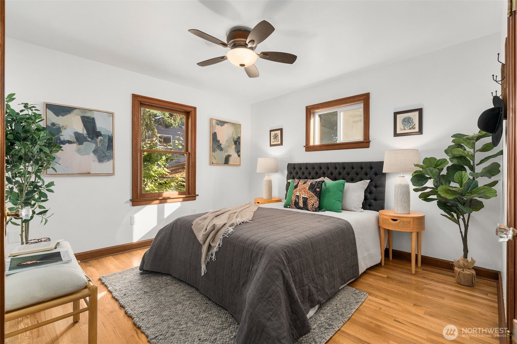 8606 29th Avenue Northwest Seattle, WA 98117 - Photo 13 of 33 a bedroom with a bed potted plant and a window