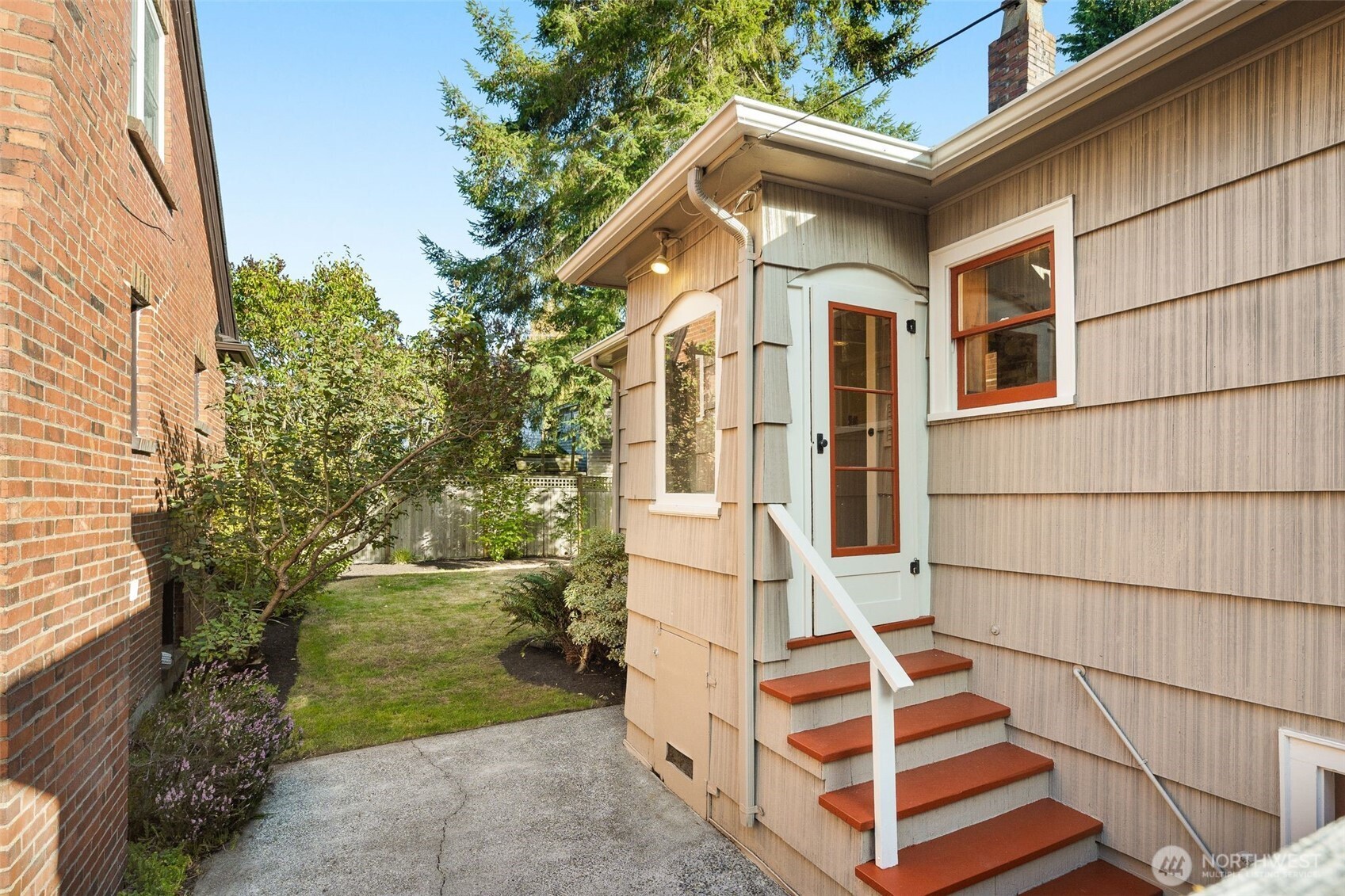 8606 29th Avenue Northwest Seattle, WA 98117 - Photo 22 of 33 a front view of a house with a yard