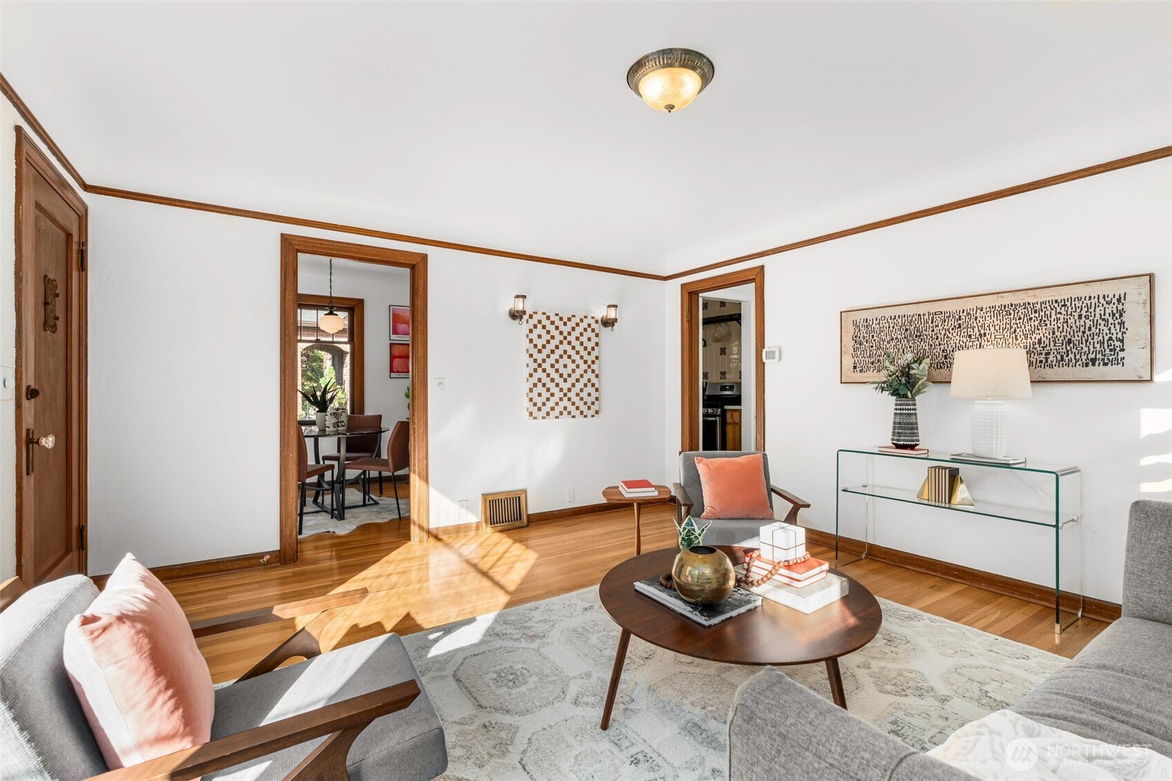 8606 29th Avenue Northwest Seattle, WA 98117 - Photo 4 of 33 a living room with furniture and a wooden floor
