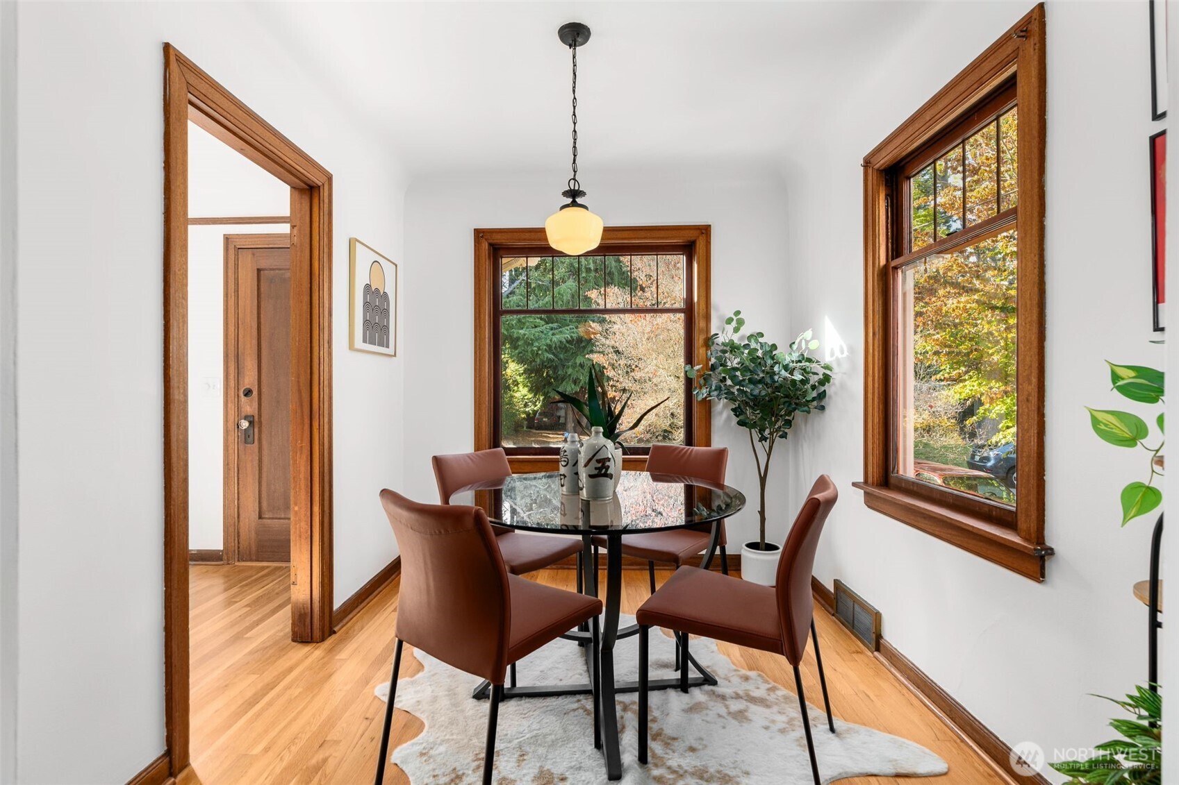 8606 29th Avenue Northwest Seattle, WA 98117 - Photo 7 of 33 a dining room with furniture window wooden floor