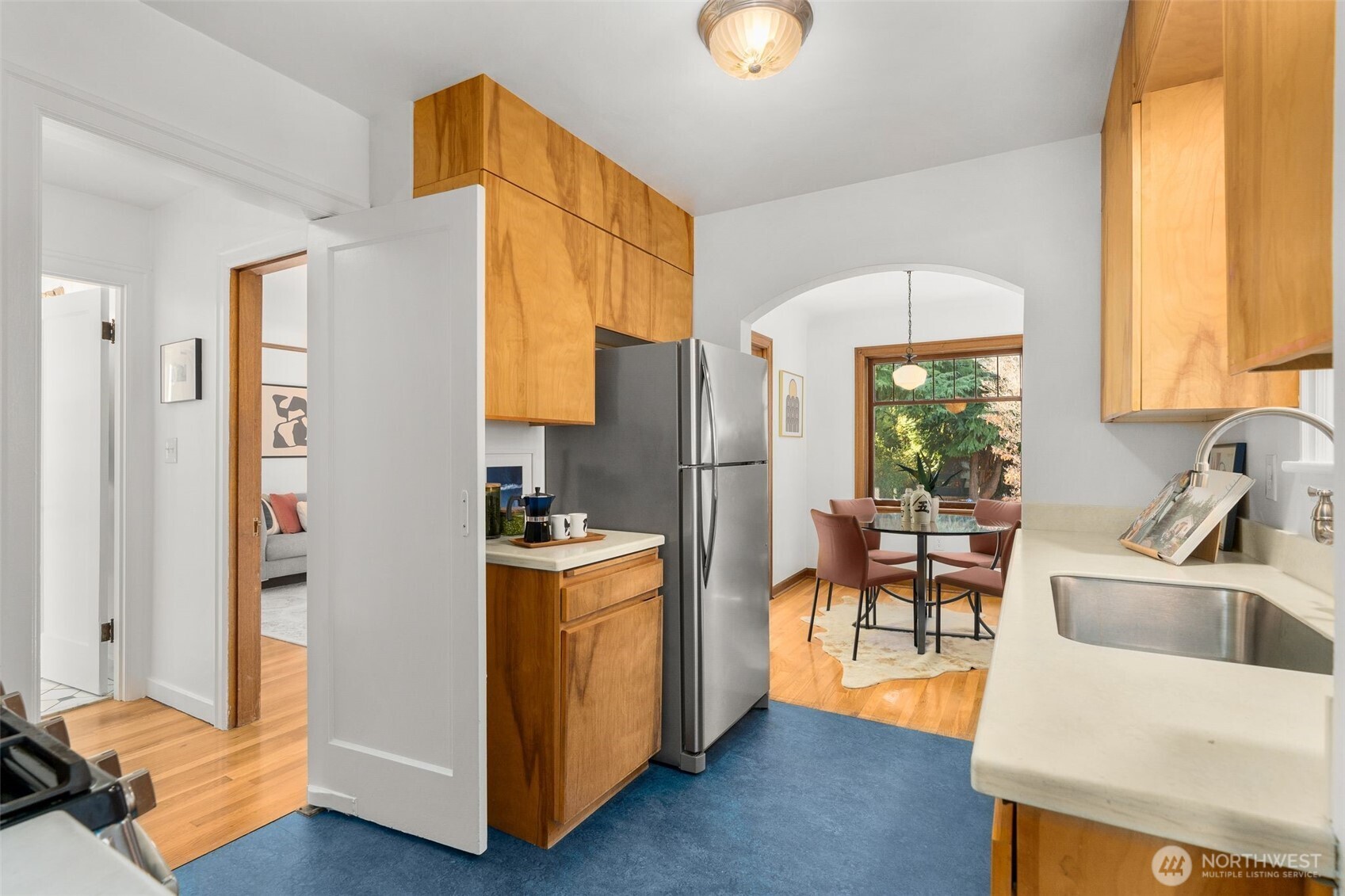 8606 29th Avenue Northwest Seattle, WA 98117 - Photo 10 of 33 a kitchen with stainless steel appliances granite countertop a refrigerator and a sink
