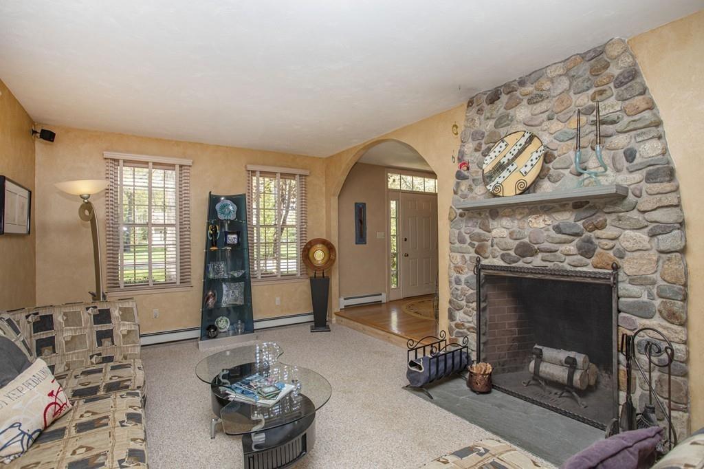 50 Lady Slipper Road Bridgewater, MA 02324 - Photo 12 of 37 a living room with furniture a fireplace and decor