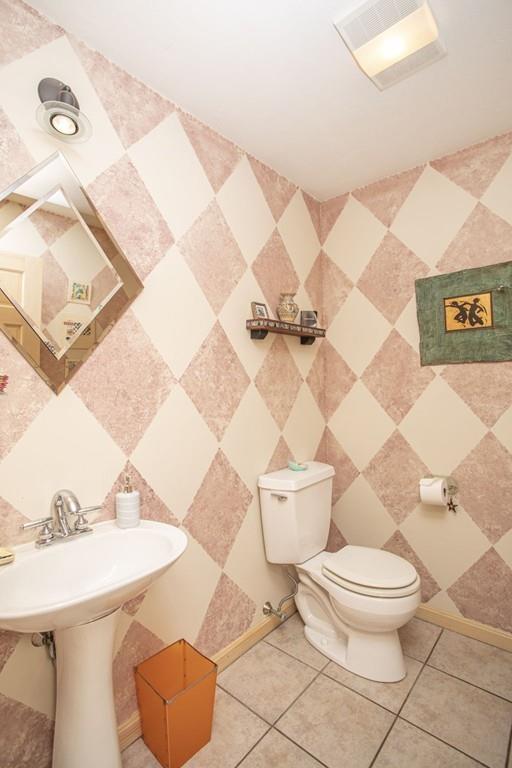 50 Lady Slipper Road Bridgewater, MA 02324 - Photo 18 of 37 a white toilet sitting next to a bathroom and sink