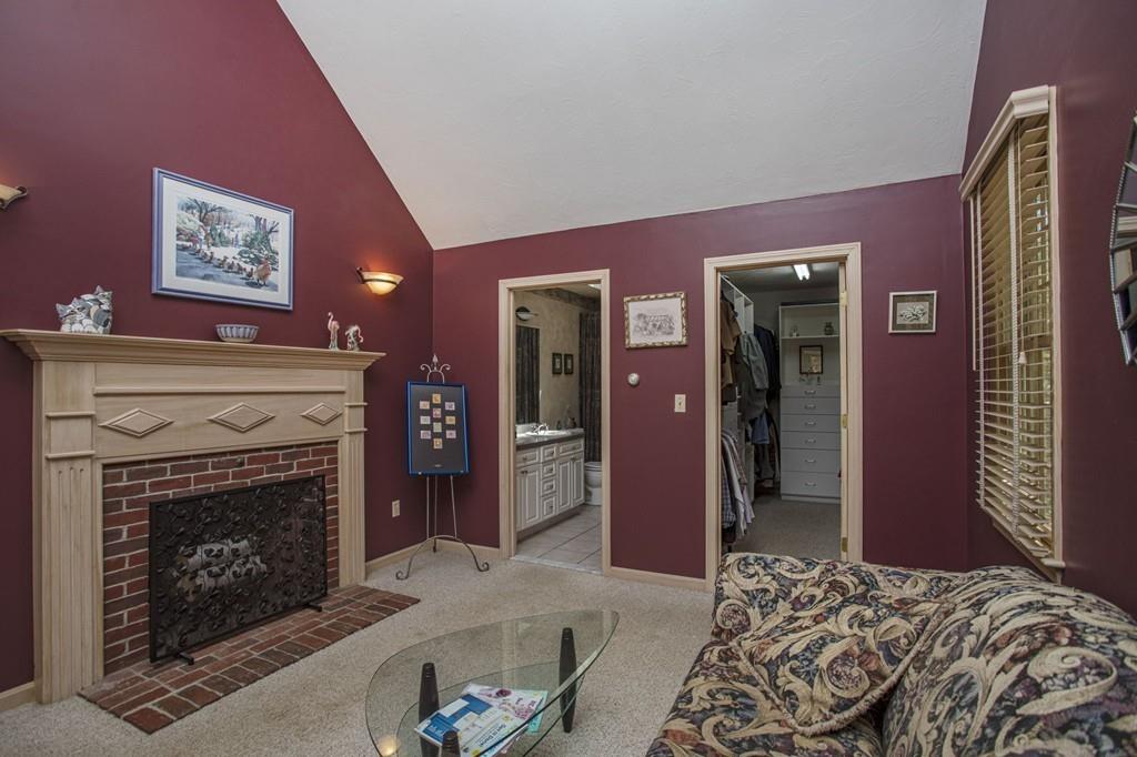 50 Lady Slipper Road Bridgewater, MA 02324 - Photo 23 of 37 a living room with a couch and a fireplace