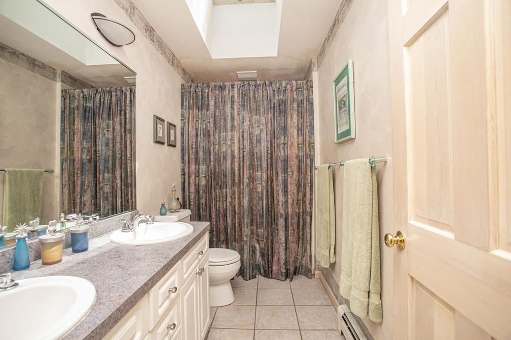50 Lady Slipper Road Bridgewater, MA 02324 - Photo 24 of 37 a bathroom with a granite countertop sink toilet and shower