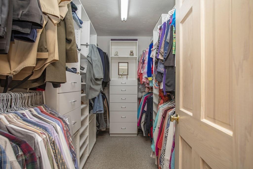 50 Lady Slipper Road Bridgewater, MA 02324 - Photo 25 of 37 a view of walk in closet with clothes
