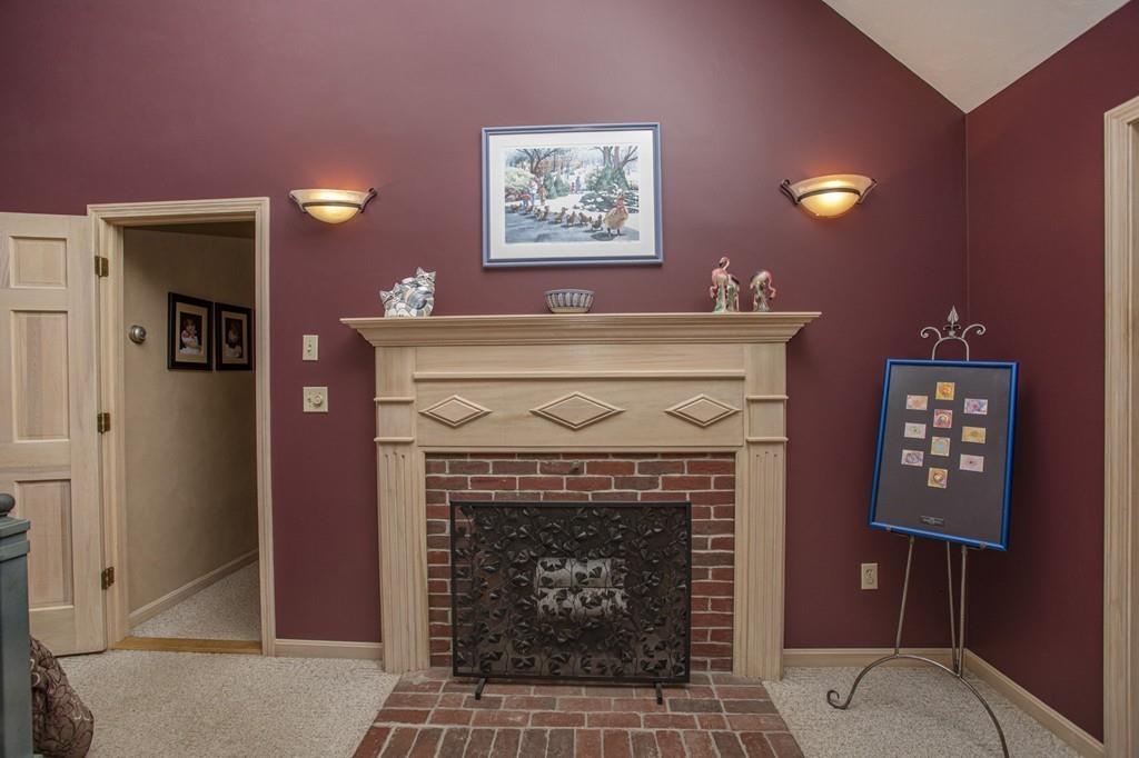 50 Lady Slipper Road Bridgewater, MA 02324 - Photo 26 of 37 a living room with furniture a fireplace and a window