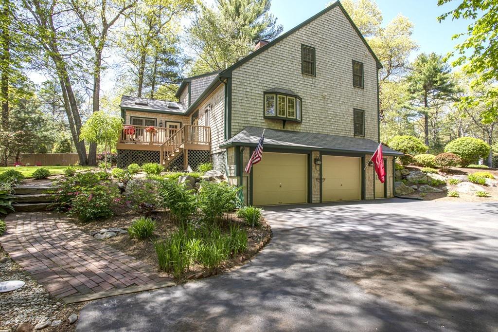 50 Lady Slipper Road Bridgewater, MA 02324 - Photo 4 of 37 a front view of a house with a yard and a garage