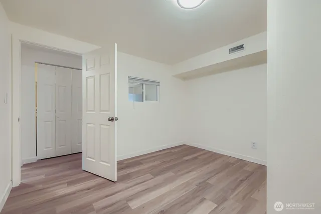 a view of a livingroom with wooden floor