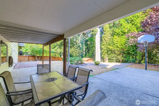 a view of an outdoor space with furniture and garden
