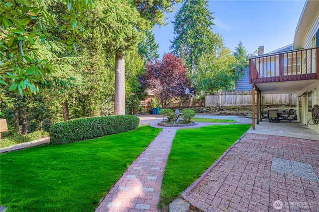 a view of a patio with a table and chairs