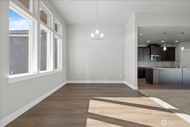 a view of a kitchen with a sink and a window
