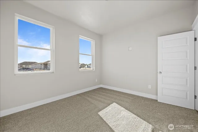 an empty room with windows