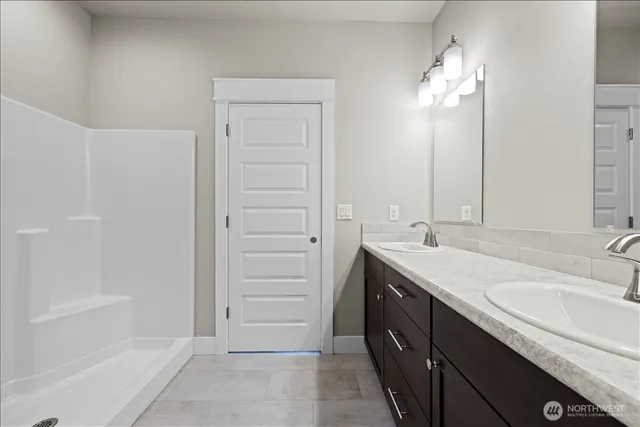 a bathroom with a sink a vanity and a mirror