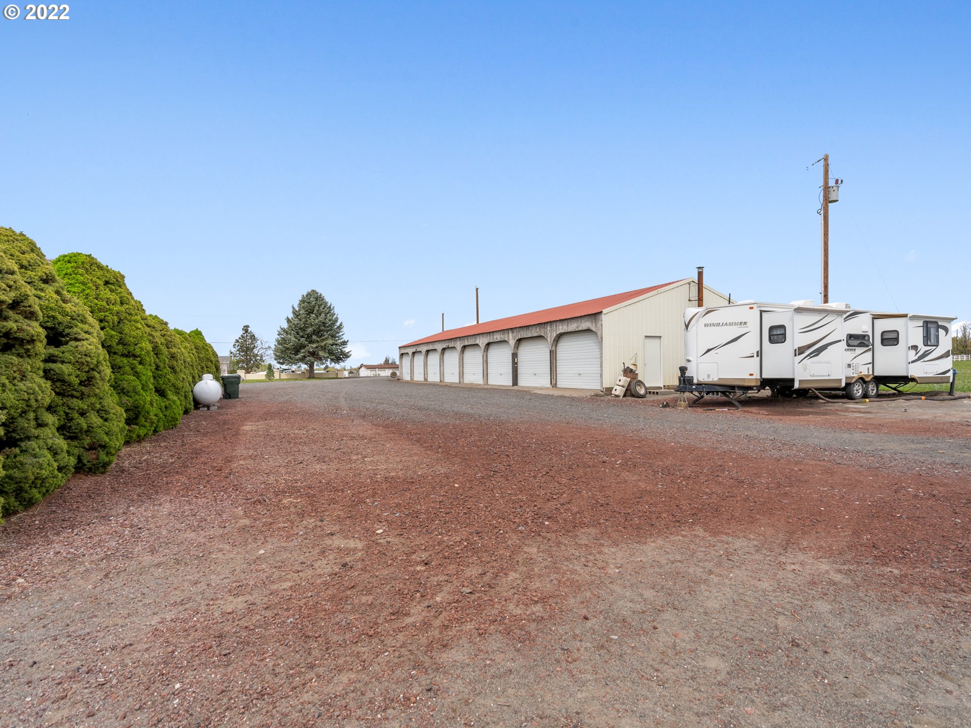 1630 North Townsend Road Hermiston, OR 97838 - Photo 23 of 24 a view of a house with large trees and outdoor space