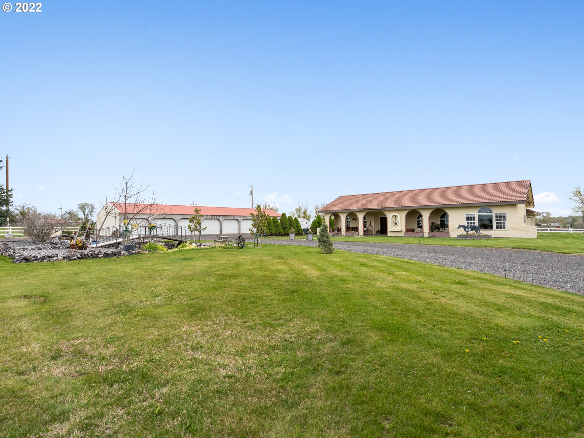 1630 North Townsend Road Hermiston, OR 97838 - Photo 3 of 24 a front view of a house with a garden