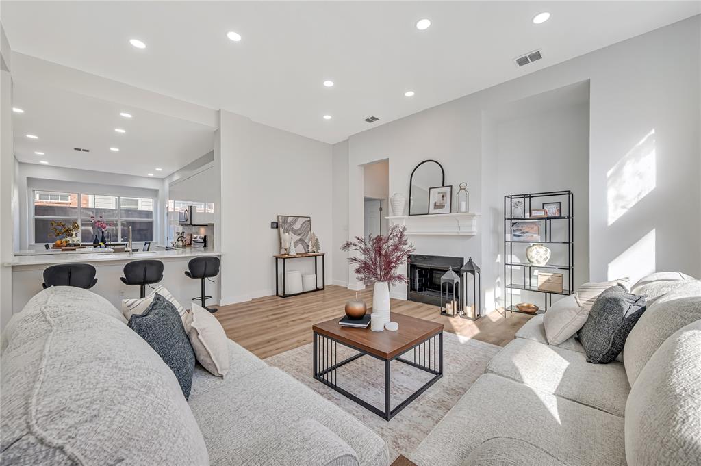 4609 Forest Park Road Plano, TX 75024 - Photo 14 of 24 Living area with recessed lighting, light wood-style floors, and a fireplace with flush hearth