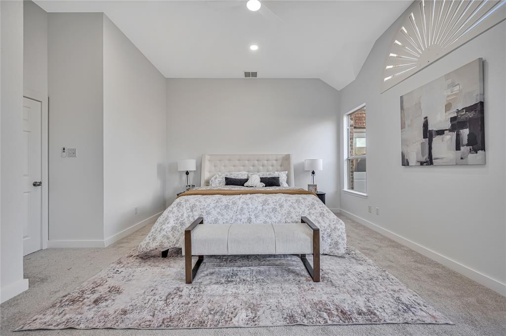 4609 Forest Park Road Plano, TX 75024 - Photo 16 of 24 Carpeted bedroom with vaulted ceiling and ceiling fan