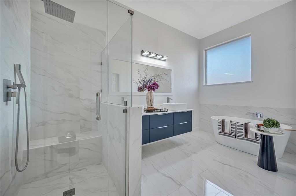 4609 Forest Park Road Plano, TX 75024 - Photo 19 of 24 Bathroom featuring a marble finish shower, vanity, light marble finish flooring, and a freestanding bath