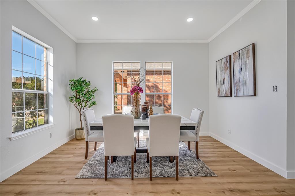 4609 Forest Park Road Plano, TX 75024 - Photo 2 of 24 Dining area featuring ornamental molding, light wood-type flooring, plenty of natural light, and recessed lighting