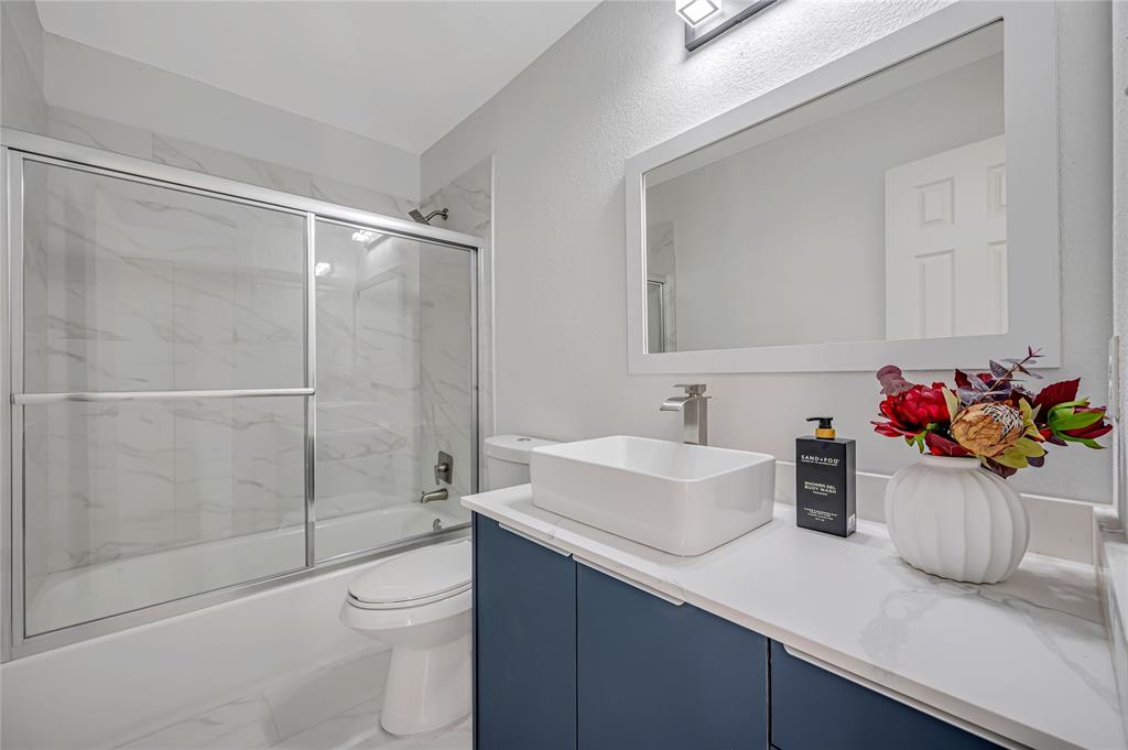 4609 Forest Park Road Plano, TX 75024 - Photo 22 of 24 Full bathroom with vanity and enclosed tub / shower combo