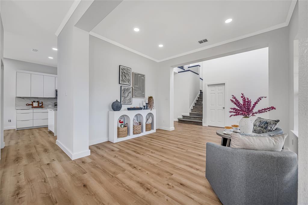 4609 Forest Park Road Plano, TX 75024 - Photo 5 of 24 Sitting room featuring ornamental molding, stairway, light wood-type flooring, and recessed lighting