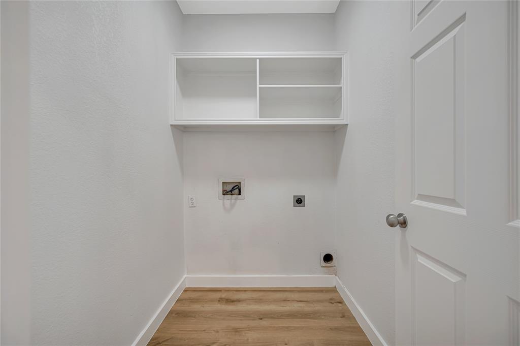 4609 Forest Park Road Plano, TX 75024 - Photo 6 of 24 Washroom featuring electric dryer hookup, light wood finished floors, and hookup for a washing machine