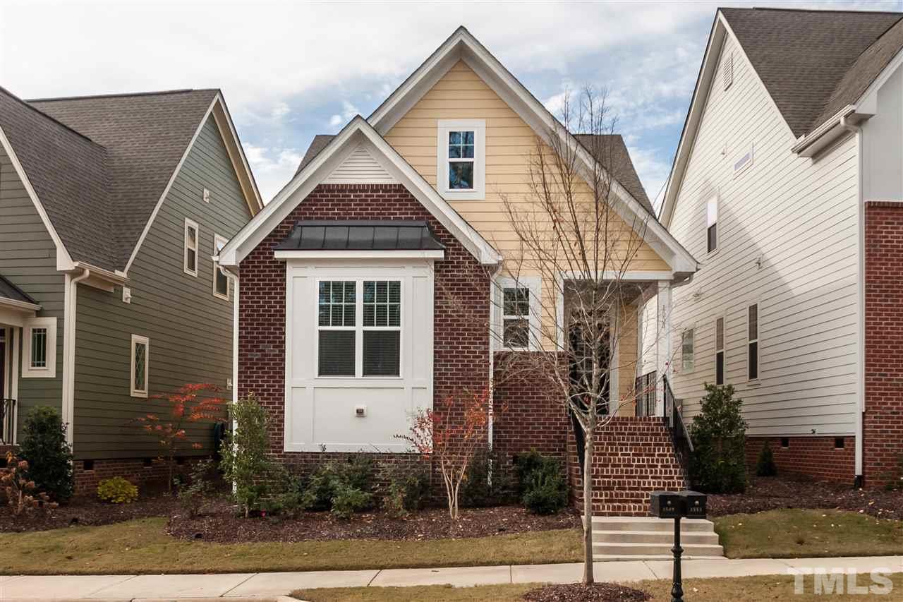 1553 Fullerton Place Raleigh, NC 27607 - Photo 1 of 25 a view of a brick house with many windows