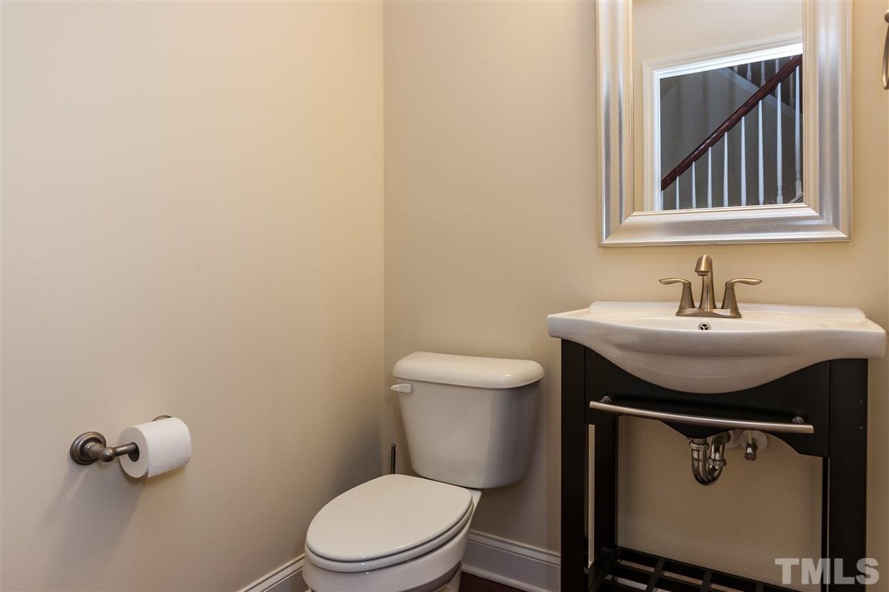 1553 Fullerton Place Raleigh, NC 27607 - Photo 14 of 25 a bathroom with a sink toilet and mirror