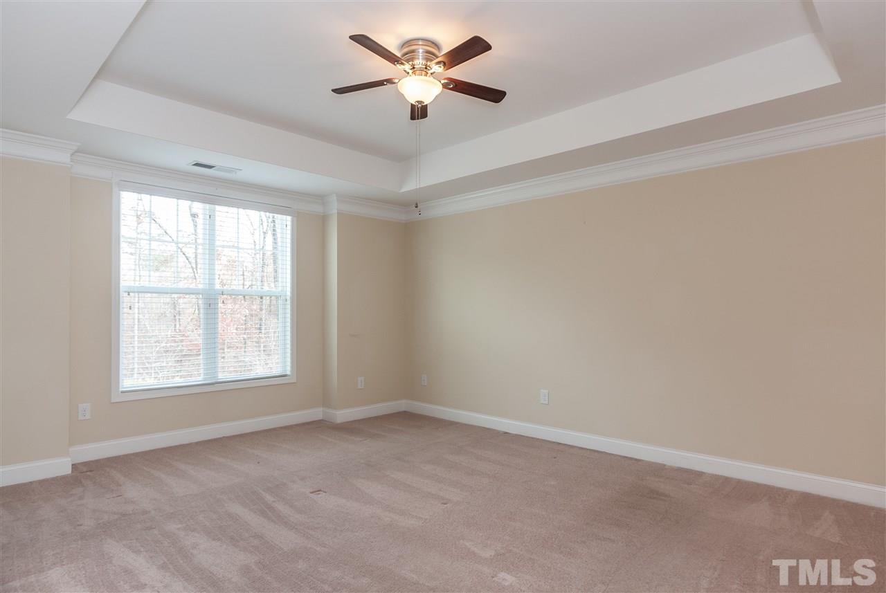 1553 Fullerton Place Raleigh, NC 27607 - Photo 15 of 25 an empty room with a window and a fan