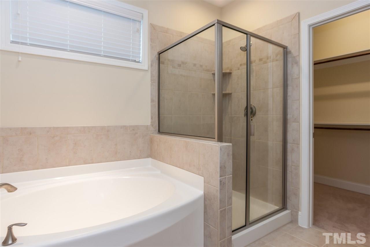 1553 Fullerton Place Raleigh, NC 27607 - Photo 18 of 25 a bathroom with a bathtub and a shower