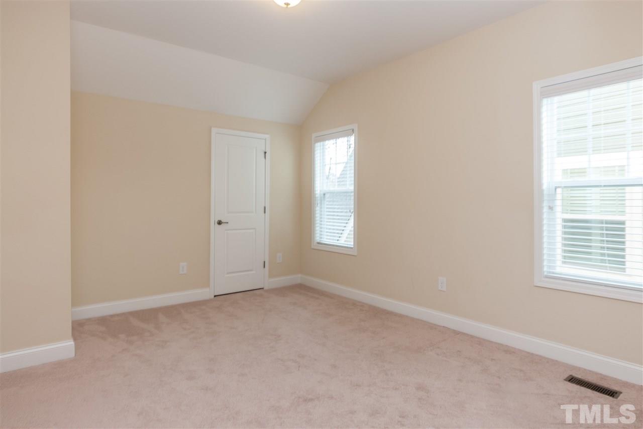1553 Fullerton Place Raleigh, NC 27607 - Photo 21 of 25 an empty room with windows