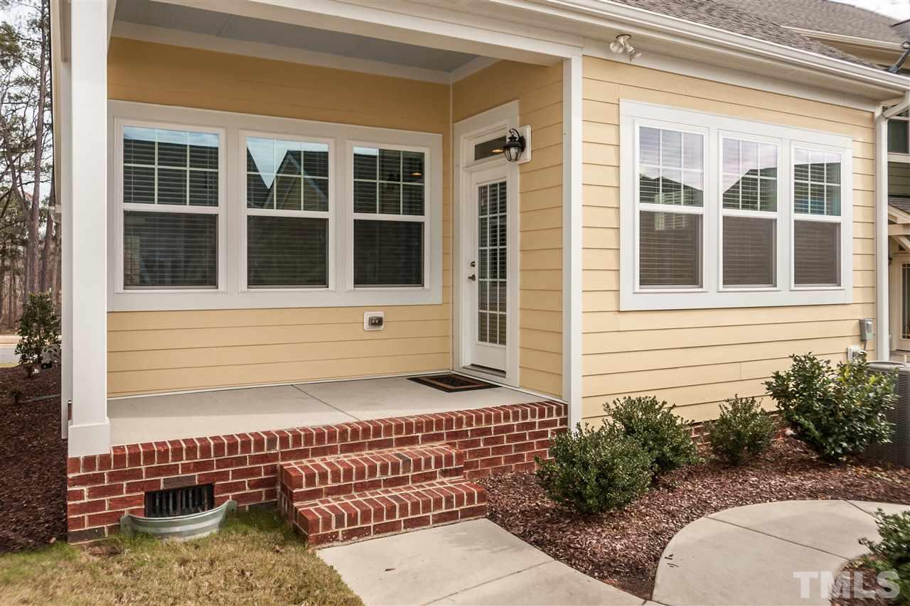 1553 Fullerton Place Raleigh, NC 27607 - Photo 24 of 25 a front view of a house with a yard