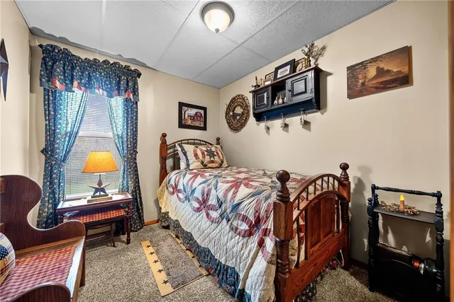 a bedroom with bed and a window