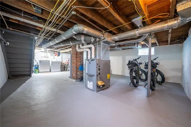 a view of house with a yard and potted plants