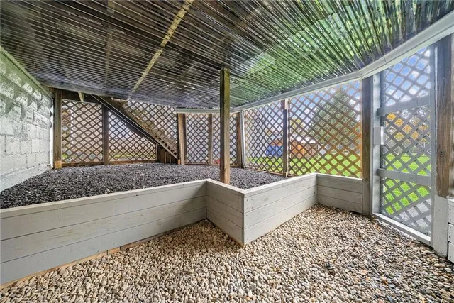a view of a wooden door and a window