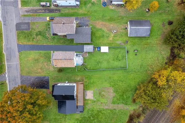 an aerial view of a house with outdoor space