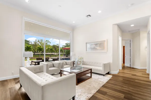 a view of a dining room with furniture wooden floor and a carpet