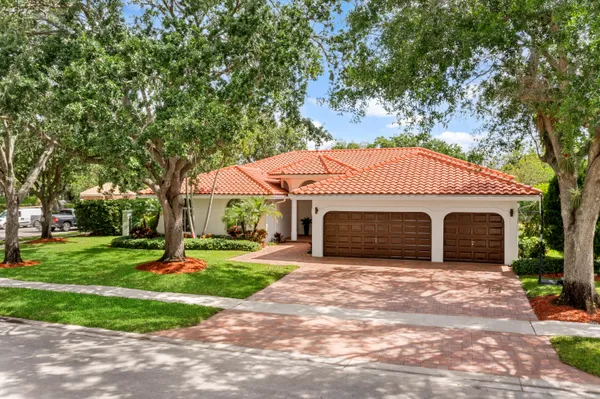 a large kitchen with stainless steel appliances granite countertop a stove and a sink